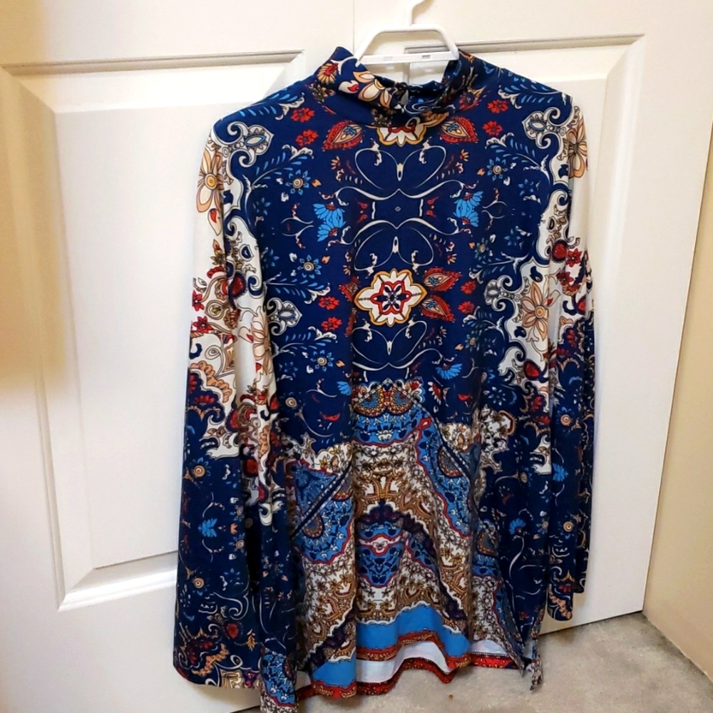 Mock turtleneck tunic top.  Unique print.  Blue, red, turquoise and gold.